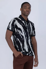 Black and white abstract polo shirt with textured mesh fabric on the torso for a stylish casual look