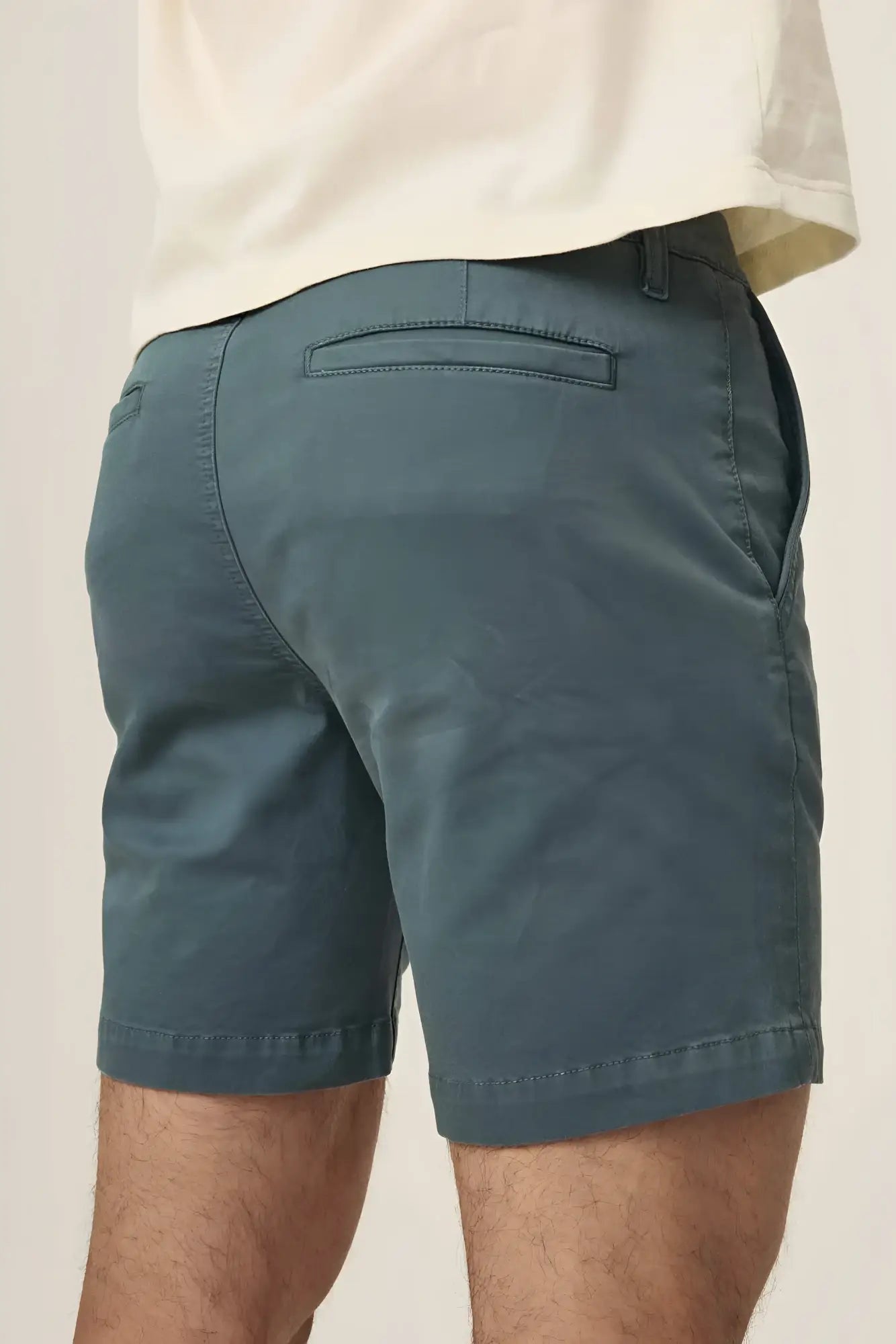 Dark teal act chino shorts with subtle texture and clean stitching ideal for casual wear