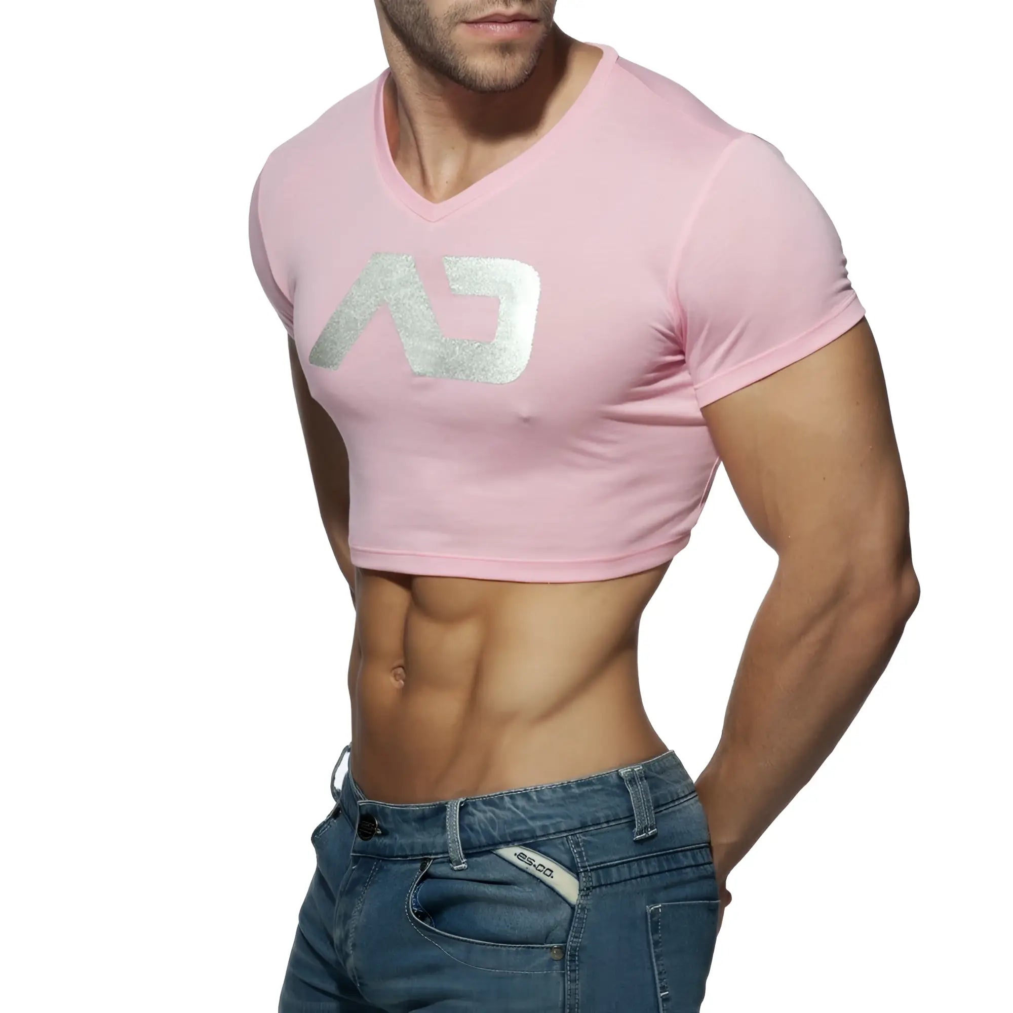 Pink cropped v neck t shirt with a silver metallic logo featuring the ad crop top design