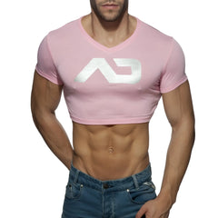 Pink cropped v neck t shirt with a white metallic logo featuring ad crop top branding