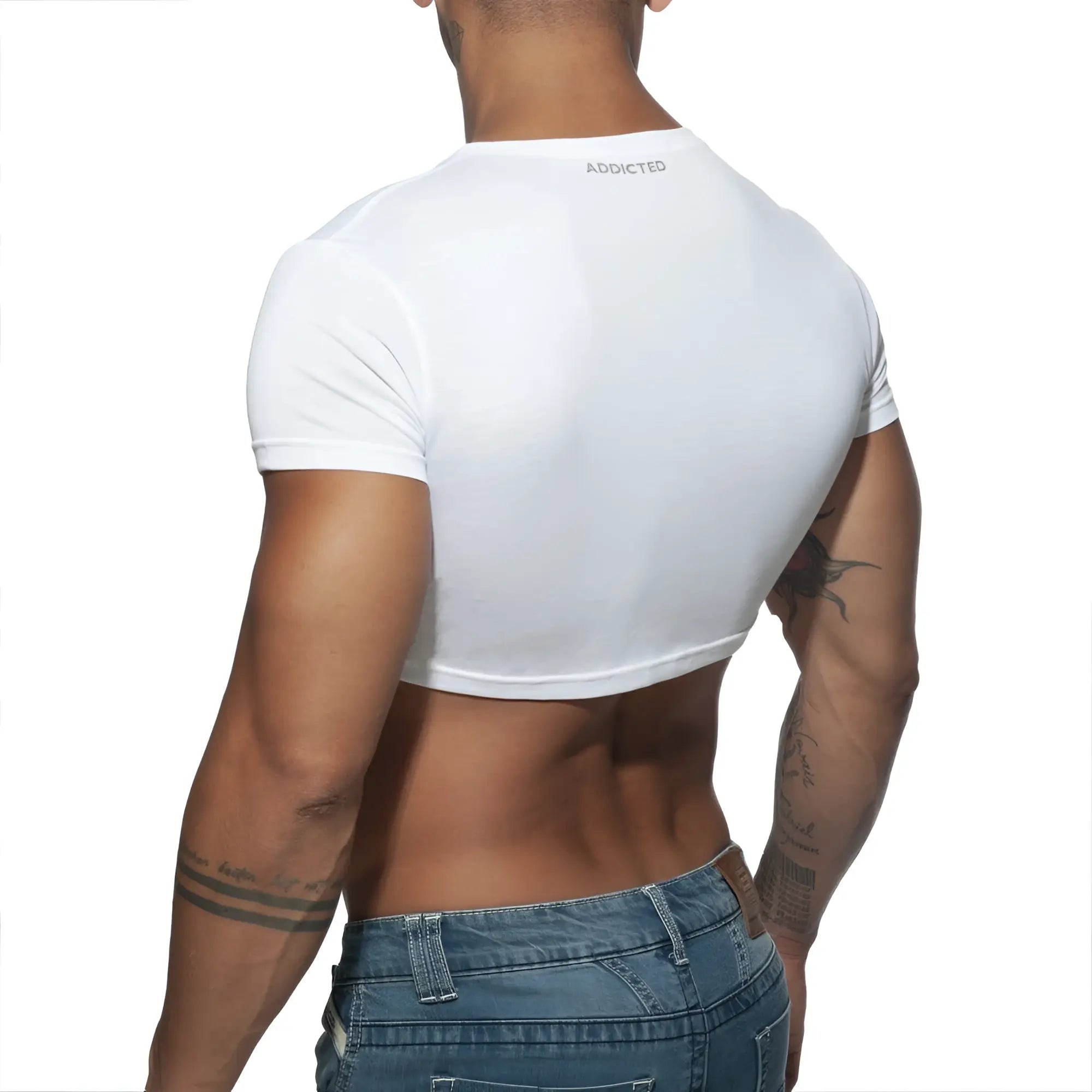 White cropped short-sleeve t-shirt with addicted branding at the neckline in ad crop top style
