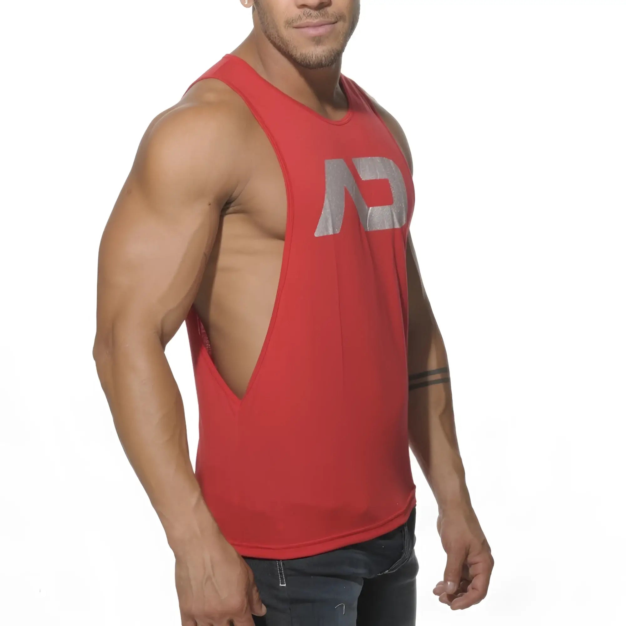 Red muscle tank top with silver ad logo and side cutout for low rider style and active wear