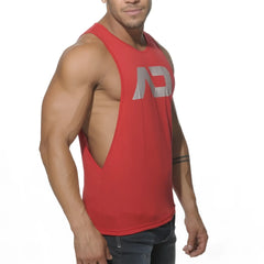 Red muscle tank top with silver ad logo and side cutout for low rider style and active wear