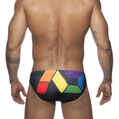 Black ad pride bikini swim trunks with bold geometric rainbow pattern in red orange yellow green blue and purple blocks