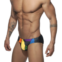 Black swim trunks with vibrant rainbow color block design from ad pride bikini collection for summer wear