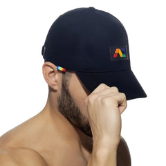 Black baseball cap ad rainbow cap with rainbow-colored logo patch and matching stripe on the ear flap