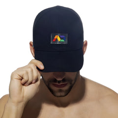Black baseball cap with a colorful geometric logo patch on the front called ad rainbow cap
