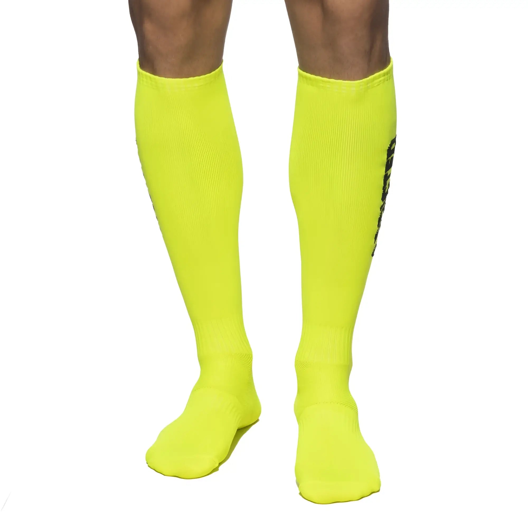 Addicted neon socks bright neon yellow knee-high athletic socks with ribbed texture and black vertical branding on side