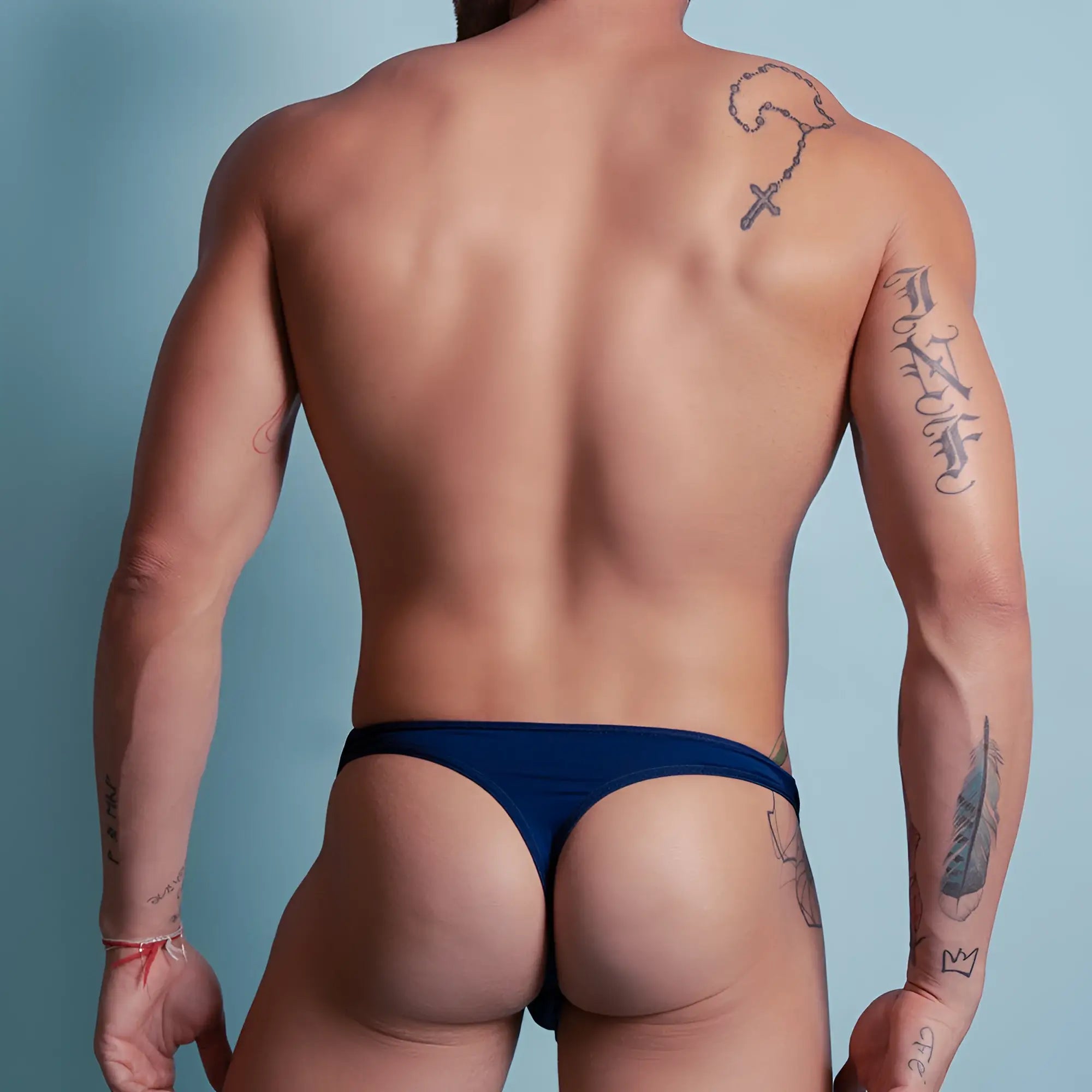 Navy blue Agacio AGK023 thong made of smooth stretchable fabric with a minimalistic design shown from the back