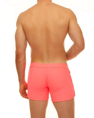 Along slit swim short bright coral swim trunks with smooth stretchy fabric and simple elastic waistband