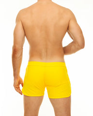Bright yellow along slit swim short swim trunks with a smooth fitted design for comfortable beachwear
