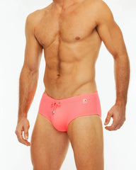 Bright pink along solid swim briefs with drawstring waistband and small front logo for swimming and beachwear