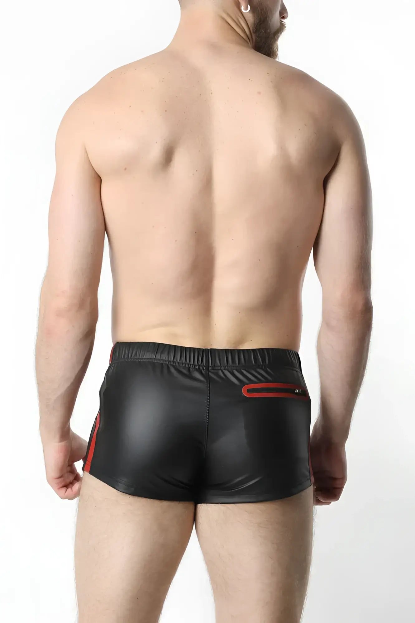 Black shiny faux leather anti-chrome gear shorts with red side stripes and red zipper pocket on back view