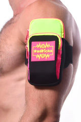 Neon green and black armband with pink zipper accents and bold sstricks logo patch for active use