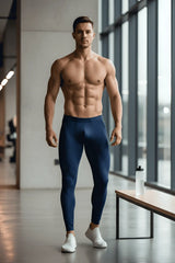 A pair of navy blue form-fitting Arroyman bulge runner tights worn by a man for athletic use