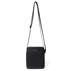 Black rectangular athletic crossbody bag with matching adjustable strap for hands-free carrying and active use