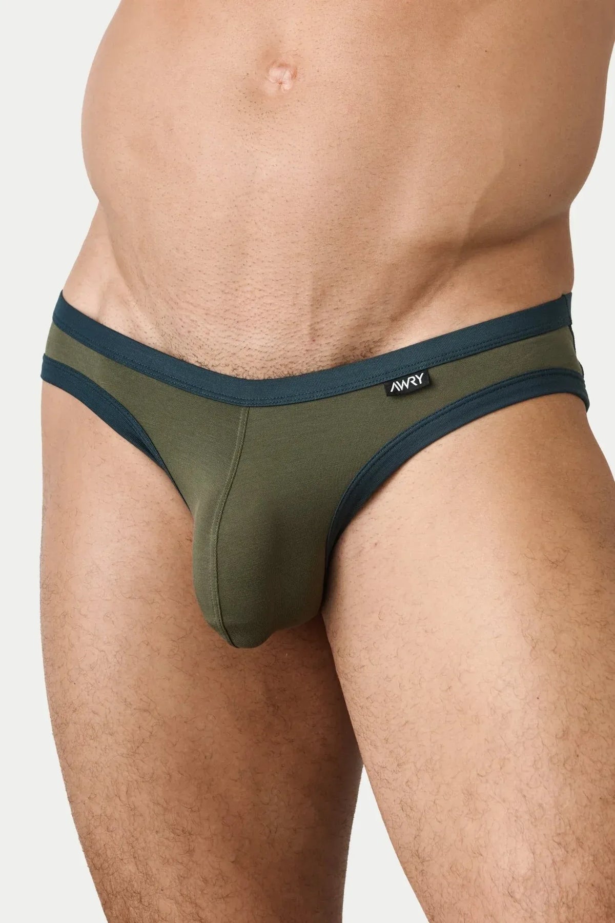 AWRY Menswear Aura briefs in olive green with dark teal trim on a model against a plain background.