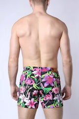 Balboa hybrid swim short vibrant floral-patterned swim trunks in bold pink purple green on black background