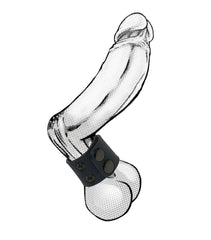 Black leather ball strap with yellow detailing and three circular metal studs wrapped around phallic-shaped object