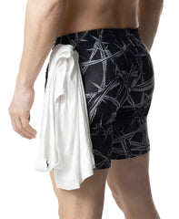 Black swim trunks with bold white barbed wire pattern and white towel tied at the waist in barbed wire rugby short style