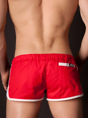 Back side of red barcode berlin gym shorts with white trim and black logo on back pocket size s/m