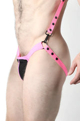 Bright pink leather harness-style thong with black mesh panel and adjustable straps in bare mesh 2.0 mesh jock cup