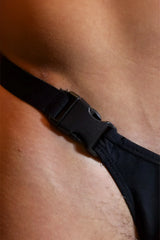 Black adjustable strap with plastic buckle on barely there modal thong made of soft breathable fabric