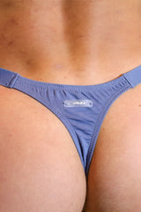 Blue denim modal thong with a clear plastic jimalbua brand tag for barely there comfort and style