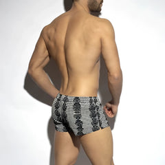 Black and white checkered baroque squared swim shorts featuring a bold geometric pattern for swimming use