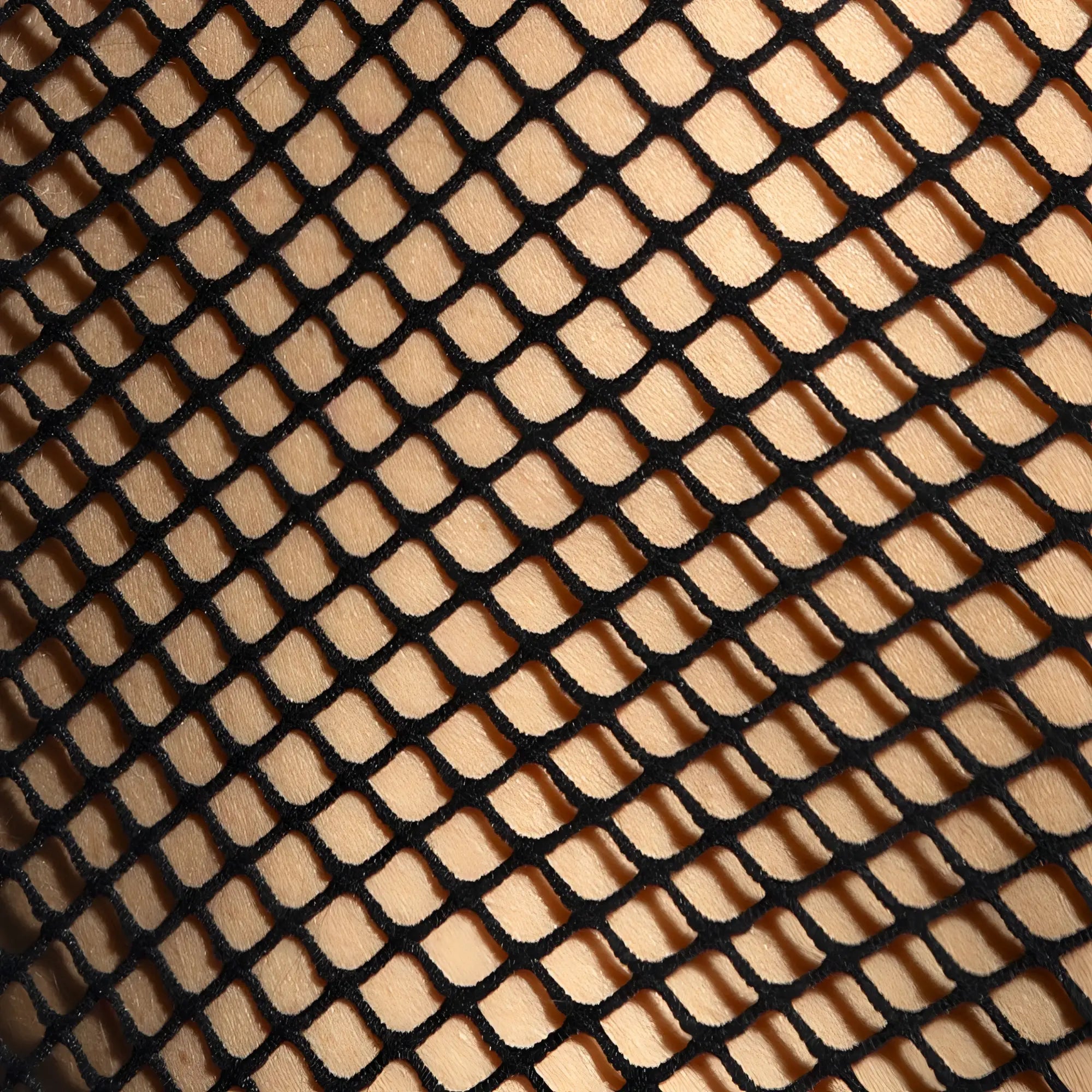 Black fishnet fabric with diamond mesh pattern on beachy net strap tank top