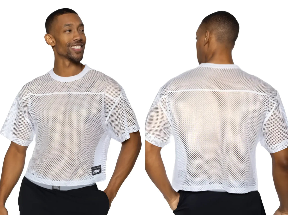 White mesh short sleeve athletic shirt with reinforced seams and black bnike tag for practice jersey use