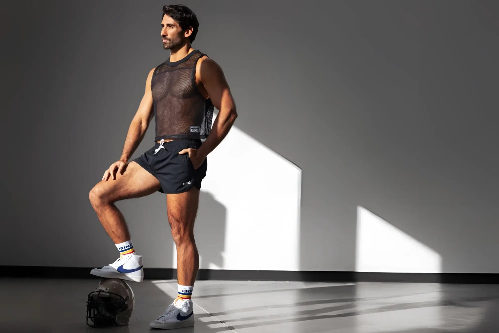 Black mesh athletic tank top with subtle texture and low-cut neckline paired with bike athletic bam200 black track short