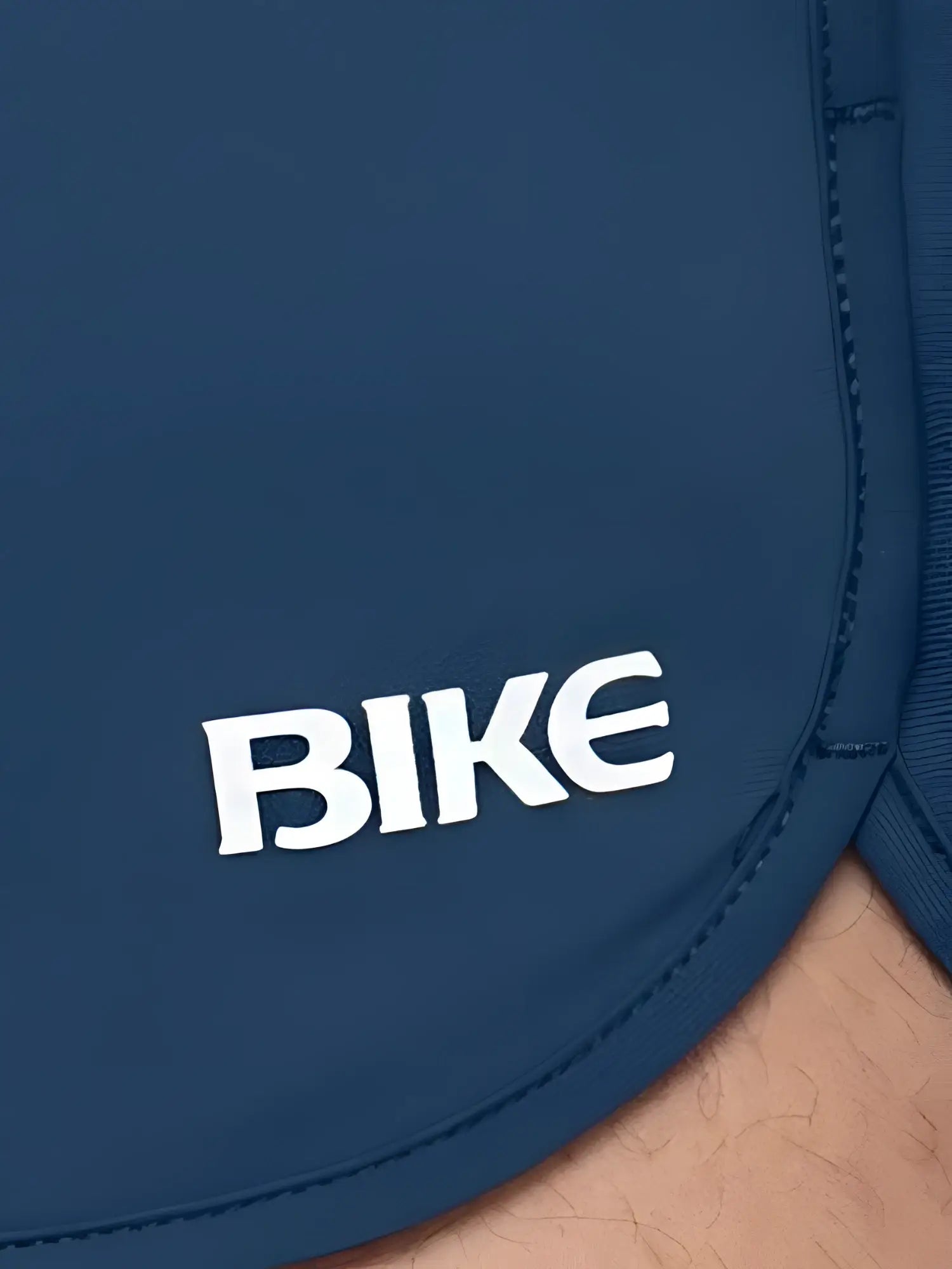 Navy blue bike athletic bam200 track shorts with white bike logo embroidered on the side for sports use