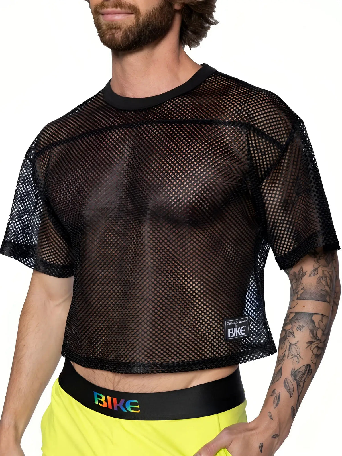 Black mesh crop top with subtle herringbone pattern and bike brand label lower left side bike practice jersey