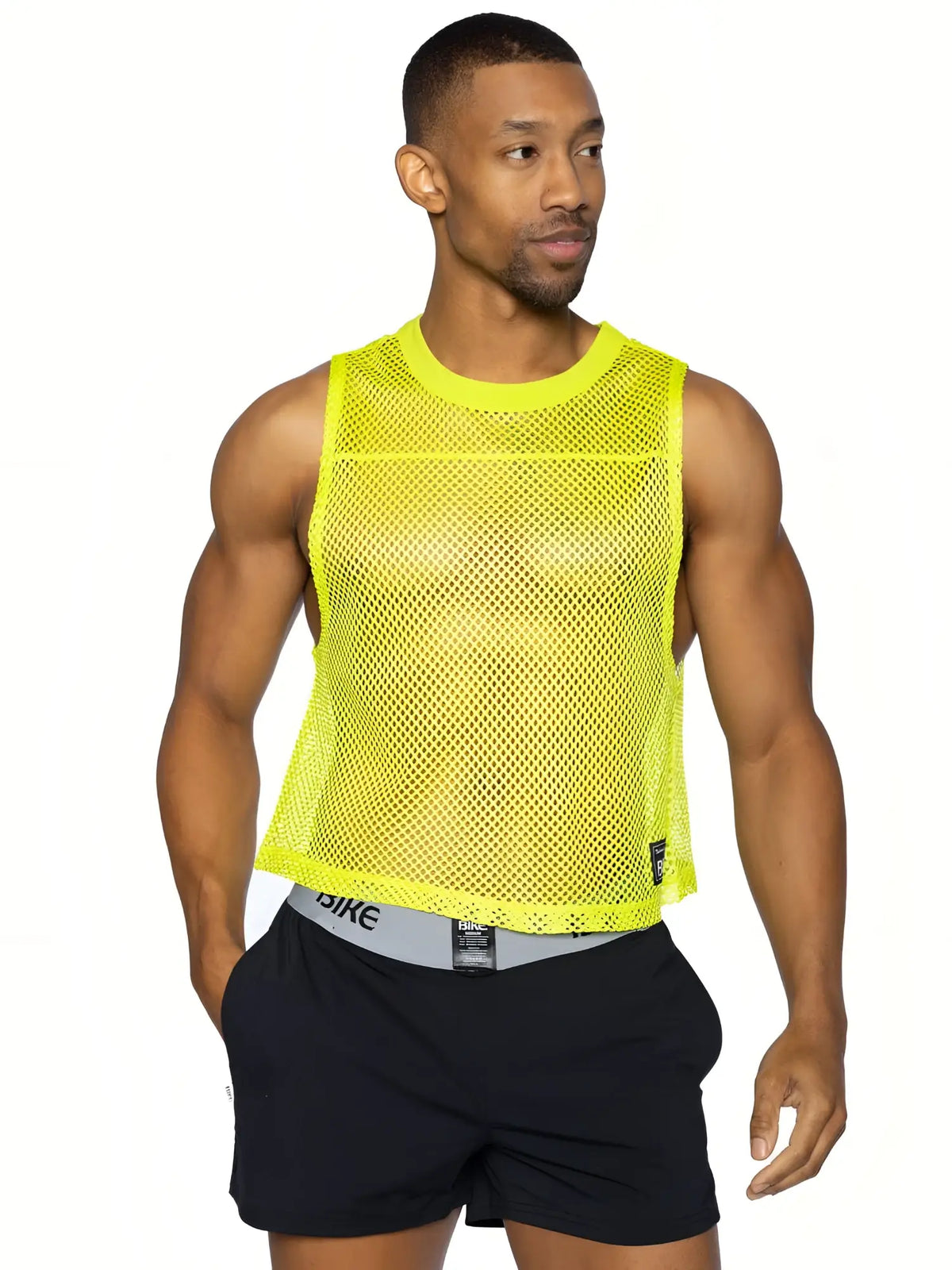 A bright neon yellow BIKE sleeve-less practice jersey mesh tank top with round neckline and subtle perforations