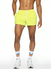 Bike track short bright neon yellow athletic shorts with white drawstring and elastic waistband for active wear