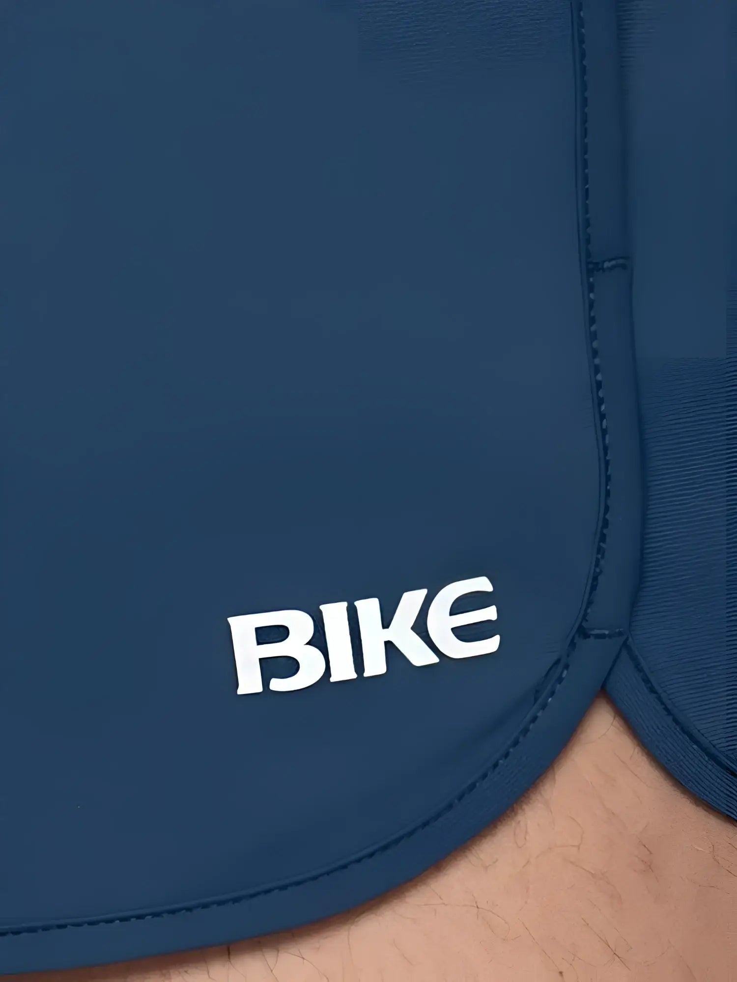 Dark blue bike track short with white bike logo embroidered on the side ideal for athletic use