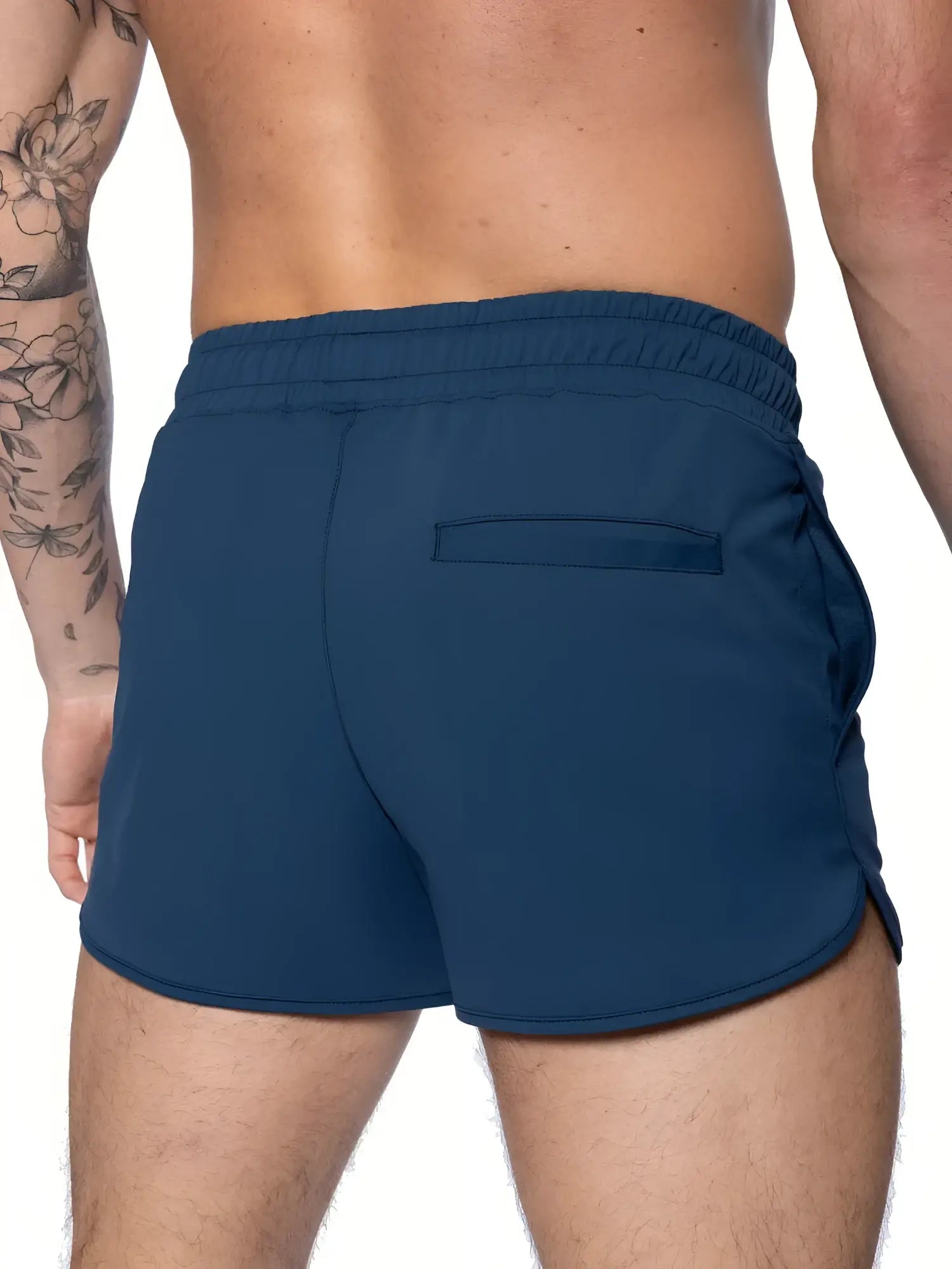 Back view of navy blue BIKE track shorts with elastic waistband and single back pocket for athletic use