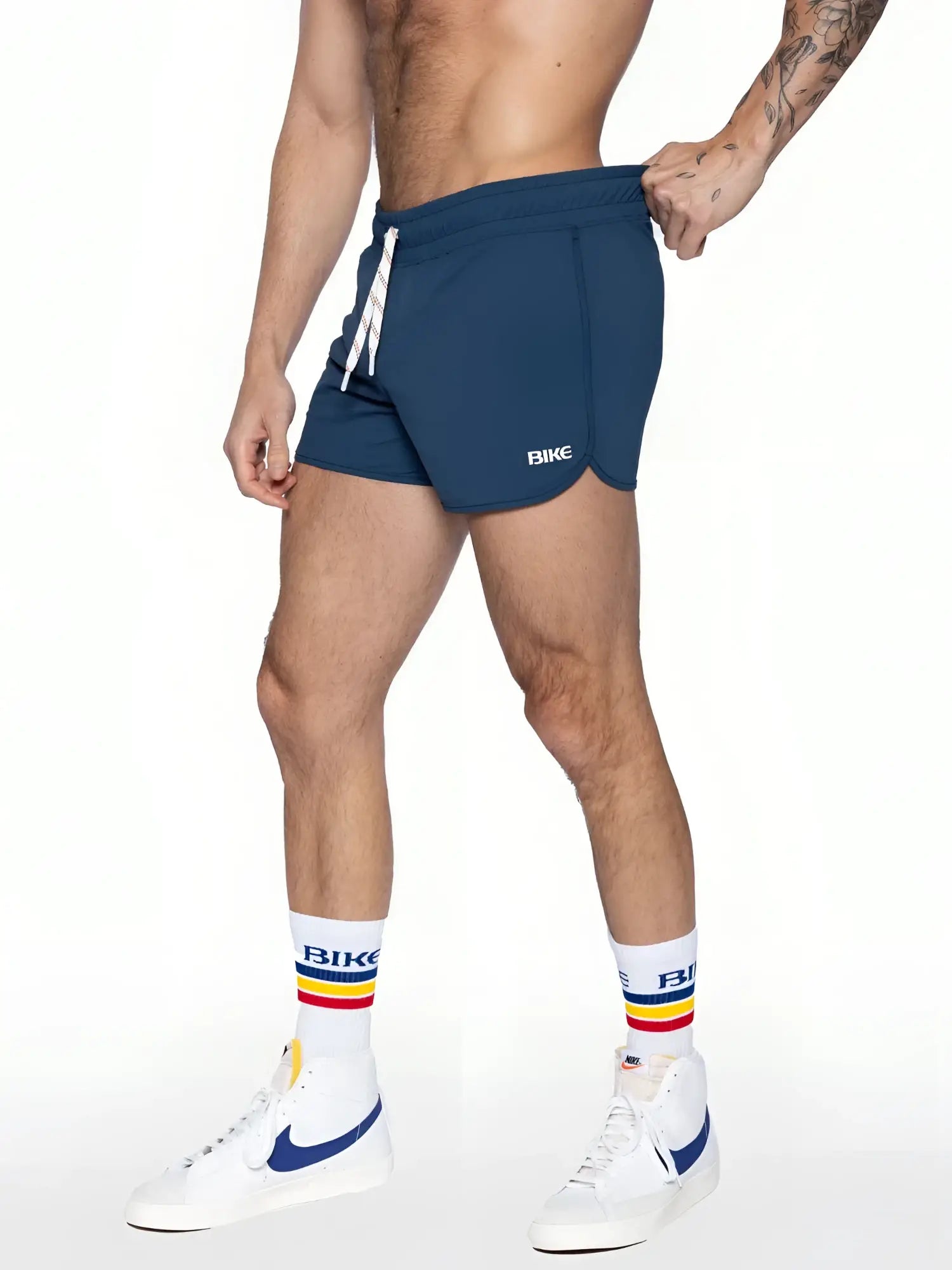 Navy blue bike track short with white drawstring and bike logo on the side designed for athletic use