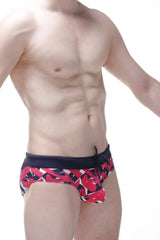 Bikini ajoupa chick red and black abstract patterned swim trunks with navy blue waistband for swimming