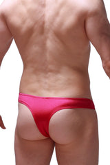 Bright pink satin thong bikini capri joe framboise with smooth glossy finish shown from the back side