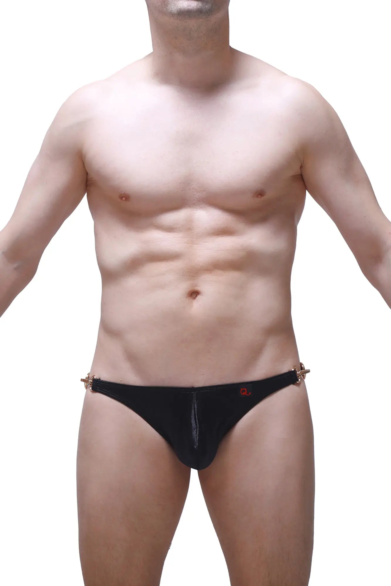 Black men’s bikini conguel satin swim trunks in black with gold-tone metal side accents and a small red logo on front