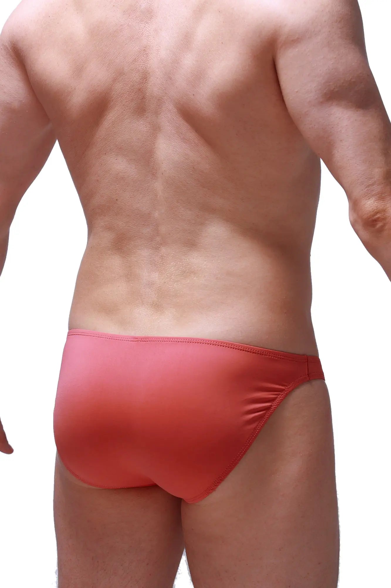 Red bikini dome blush swim trunks with form-fitting smooth stretchy fabric and subtle gradient finish front view