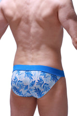 PetitQ bikini linthes maeha blue and white tropical leaf patterned swim trunks with solid blue waistband front view
