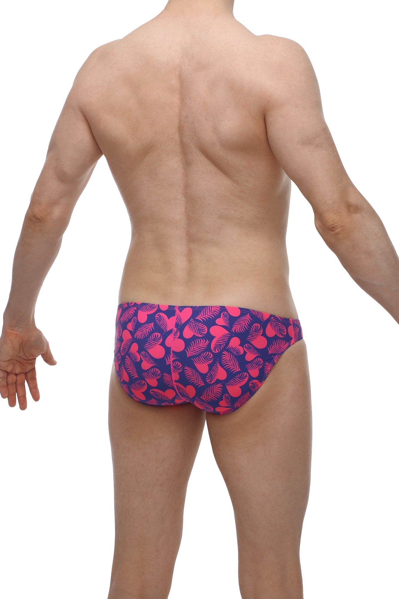 Petitq bikini taik tropical hearts vibrant pink and navy blue swim trunks with playful tropical leaf pattern