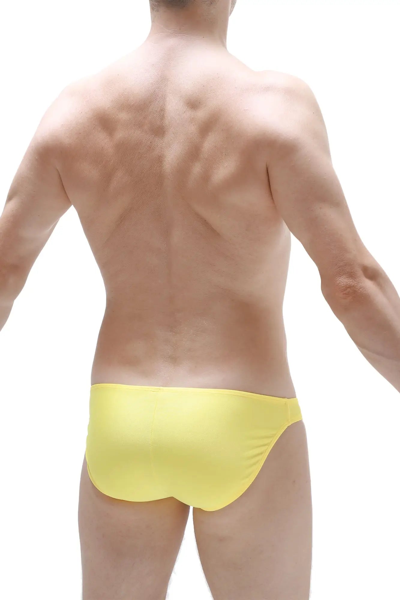 Bright yellow Bikini Taik Joe swim trunks with smooth, form-fitting fabric designed for comfortable wear