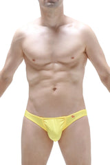 Bikini taik joe yellow bright yellow form-fitting swim trunks with a subtle red logo on the waistband