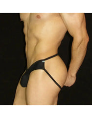 Black half bikini jockstrap underwear by Arroyman featuring a minimal design and elastic straps shown on a model.