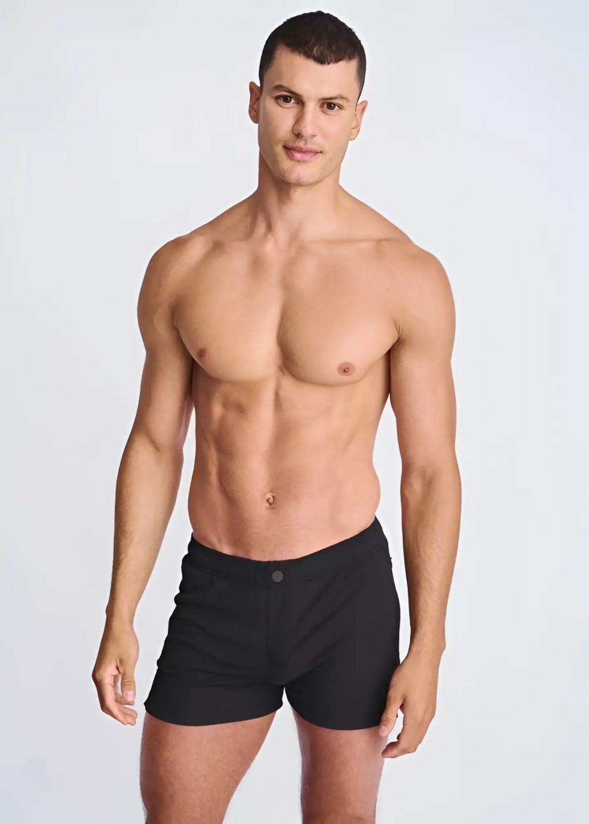 Black seersucker swim shorts with mesh lining featuring a sleek minimalist design and single button waistband closure