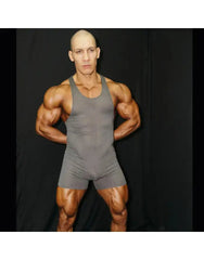 Grey mesh wrestler bodysuit by Arroyman featuring a sleeveless design and form-fitting cut modeled by a muscular individual.